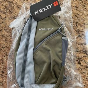 Kelty sling bag. Green